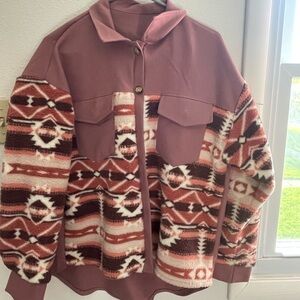 This is a small comfy little button up. It’s oversized has two pockets.